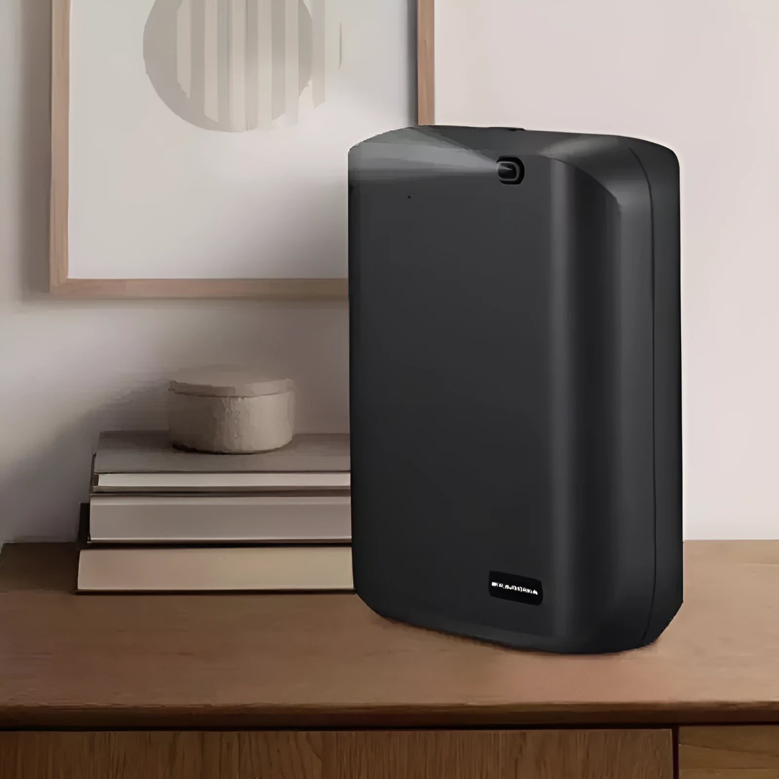 White wall-mounted smart aroma diffuser with 150ml tank and app control on a grey wall.