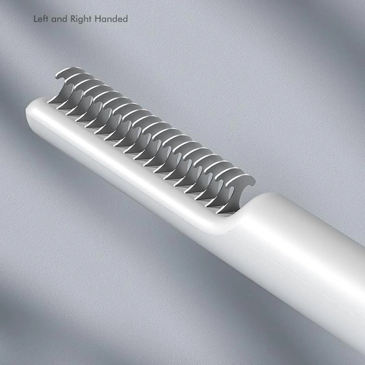 Stainless steel pet dematting comb with ergonomic handle in pink colour.