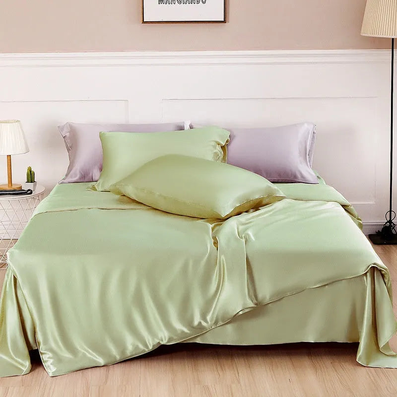 Double-sided silk duvet cover showing reversible solid colours in lotus pink and pea green options