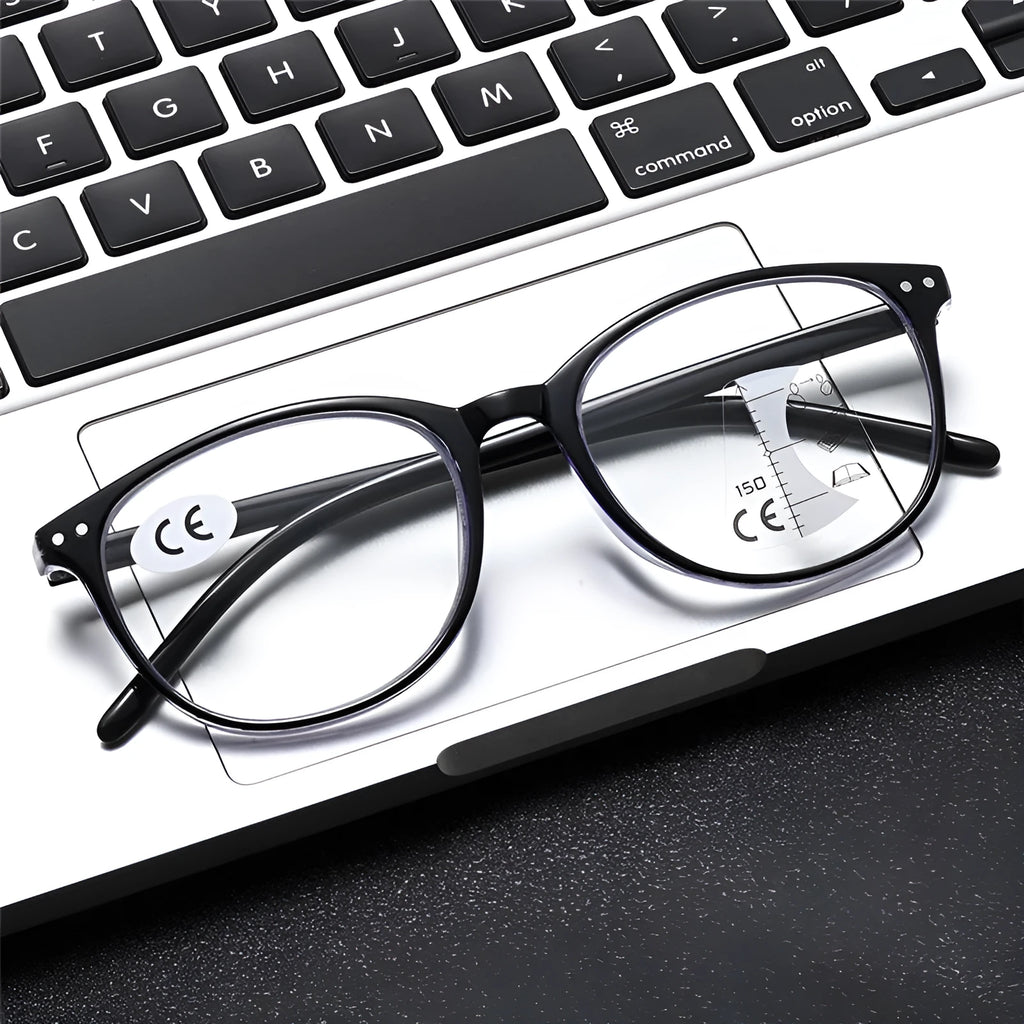 A pair of women's ultra-light presbyopic glasses with multi-focus lenses on a table, showing frame colour options.