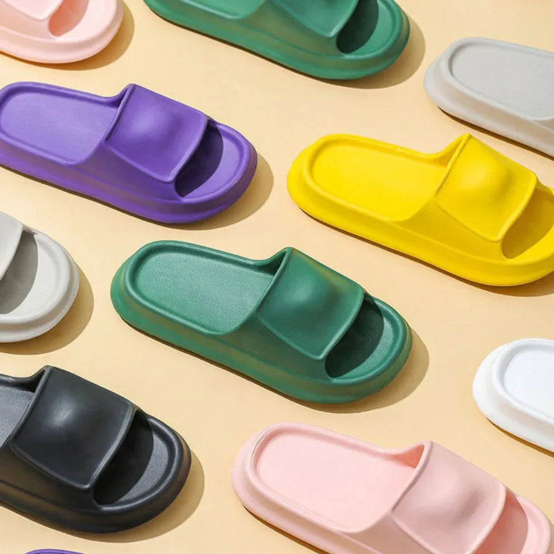Pair of thick-soled EVA foam slippers in a choice of seven colours, showing non-slip textured sole.