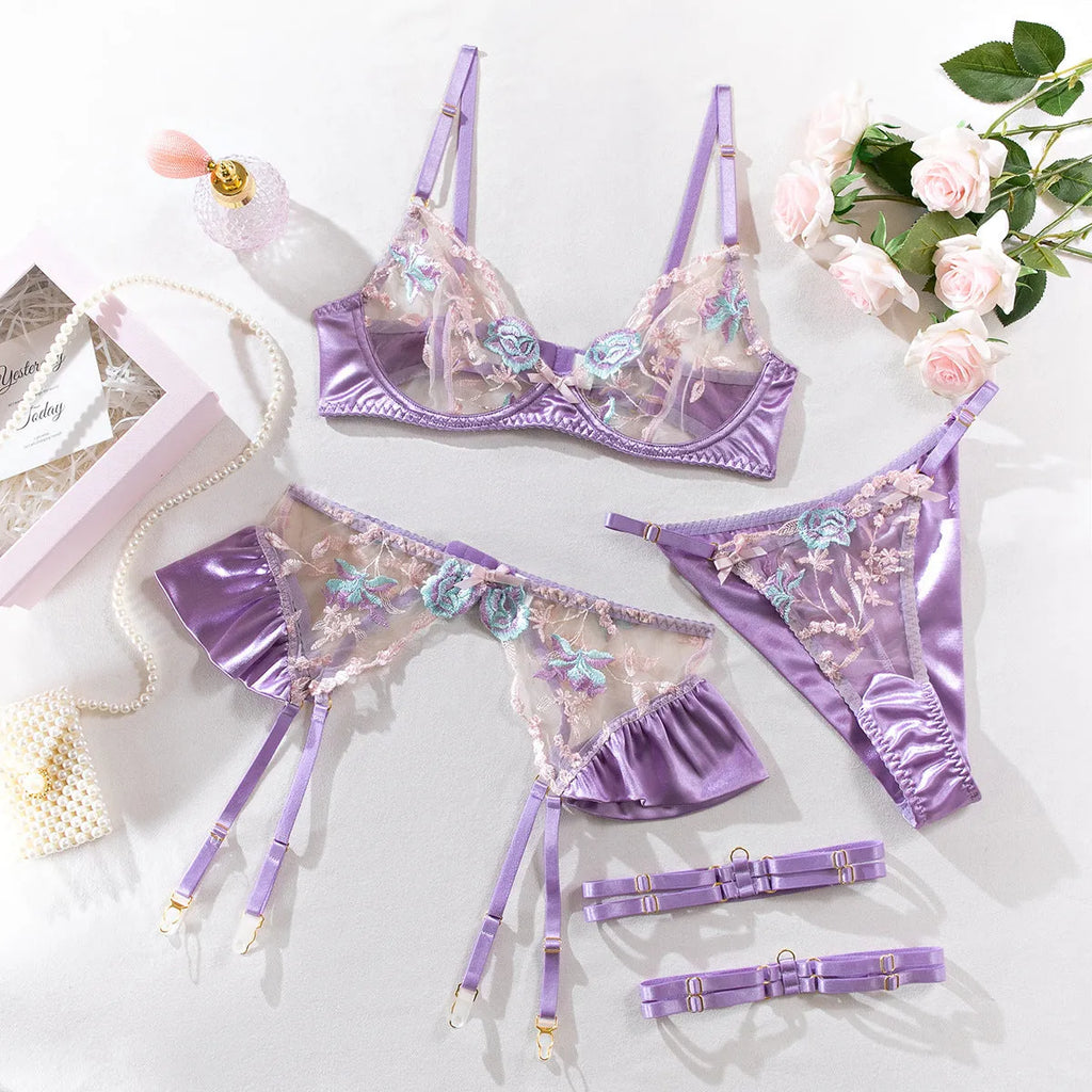 Light purple satin four-piece lingerie set with embroidery detailing shown front and back