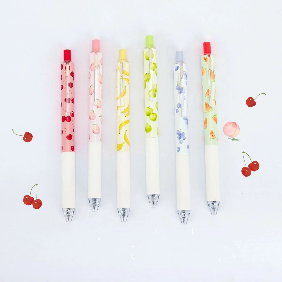 Three fruit scented pressurised pens with 0.5mm black ink and press-action mechanism