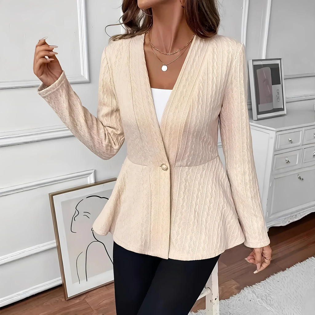 Women's apricot tight fit knitted cardigan with jacquard pattern and a single button.