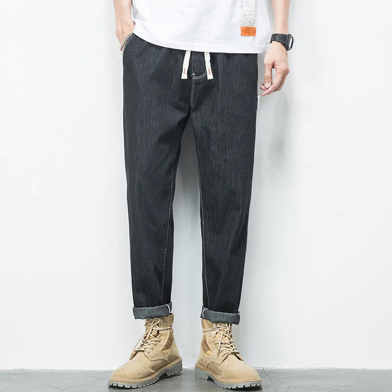 Men's loose fit plus size jeans with elastic mid waist, thin cotton denim, blue or black, sizes L to 7XL