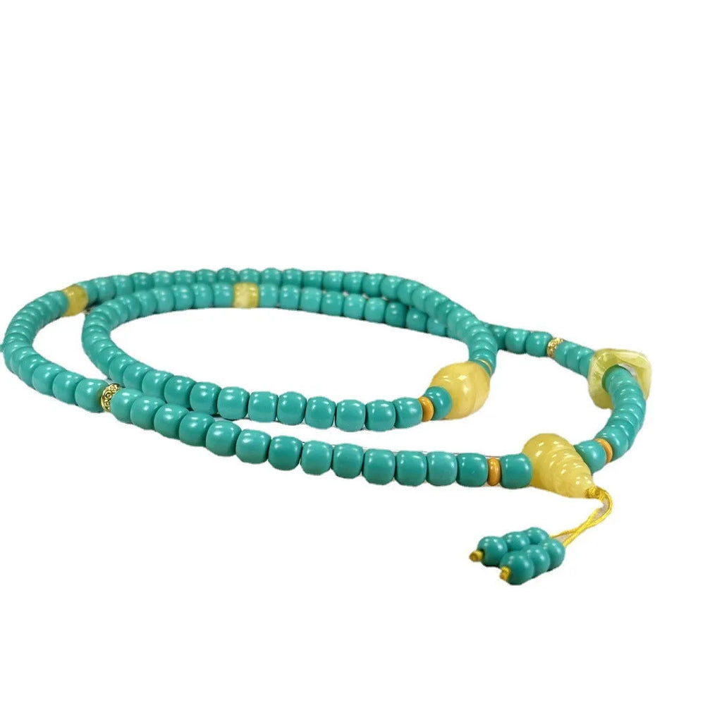 Hand-woven turquoise mesh flower lucky pendant necklace on a ball bead chain.