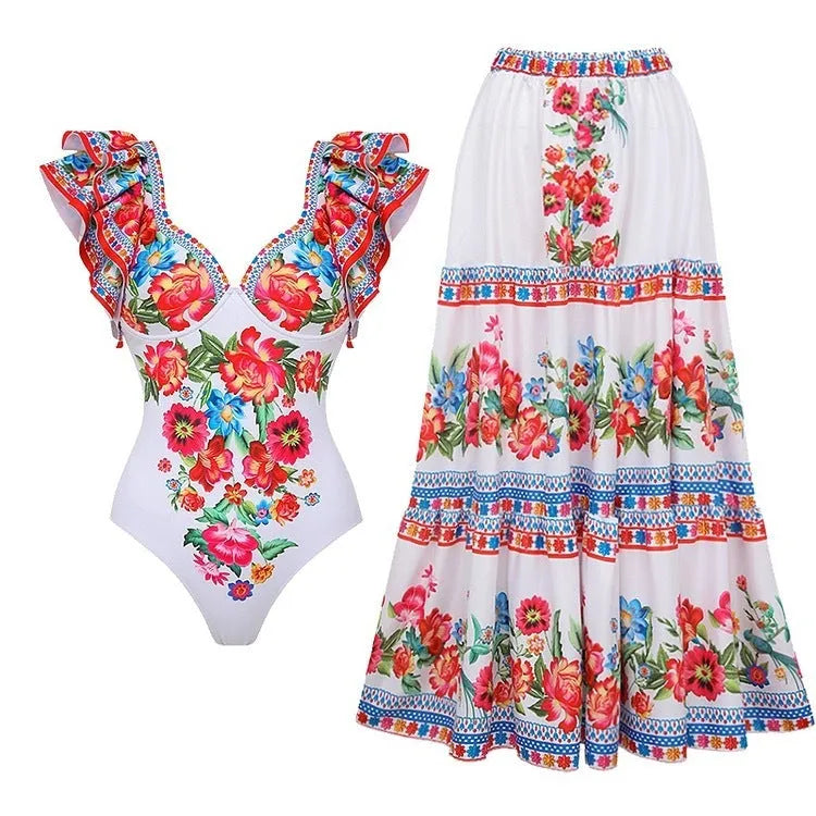 Women's printed one-piece swimsuit in rose pink on a mannequin.