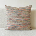 American-style yarn-dyed jacquard pillow cover with paisley pattern in amber colours on sofa