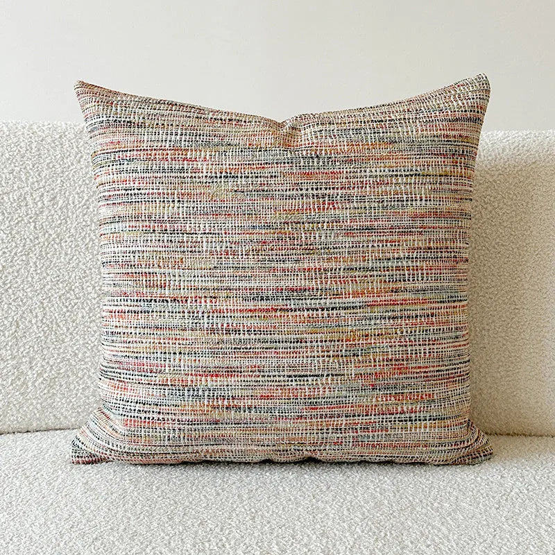 American-style yarn-dyed jacquard pillow cover with paisley pattern in amber colours on sofa