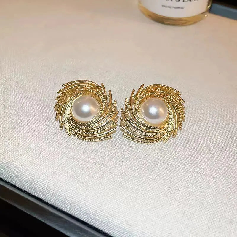 Vintage style earrings with simulated pearl drops in irregular flower shape design