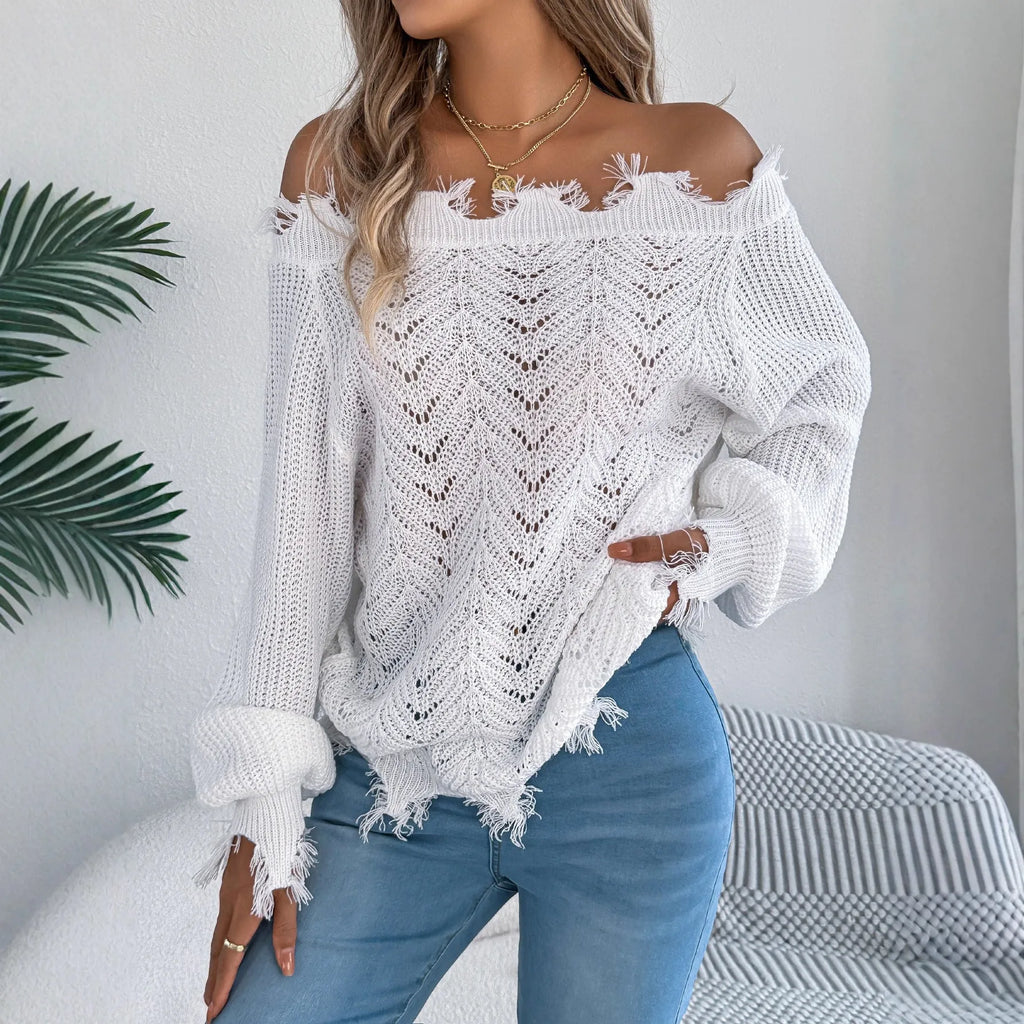 White hollow-out off-the-shoulder long-sleeve pullover sweater laid flat.