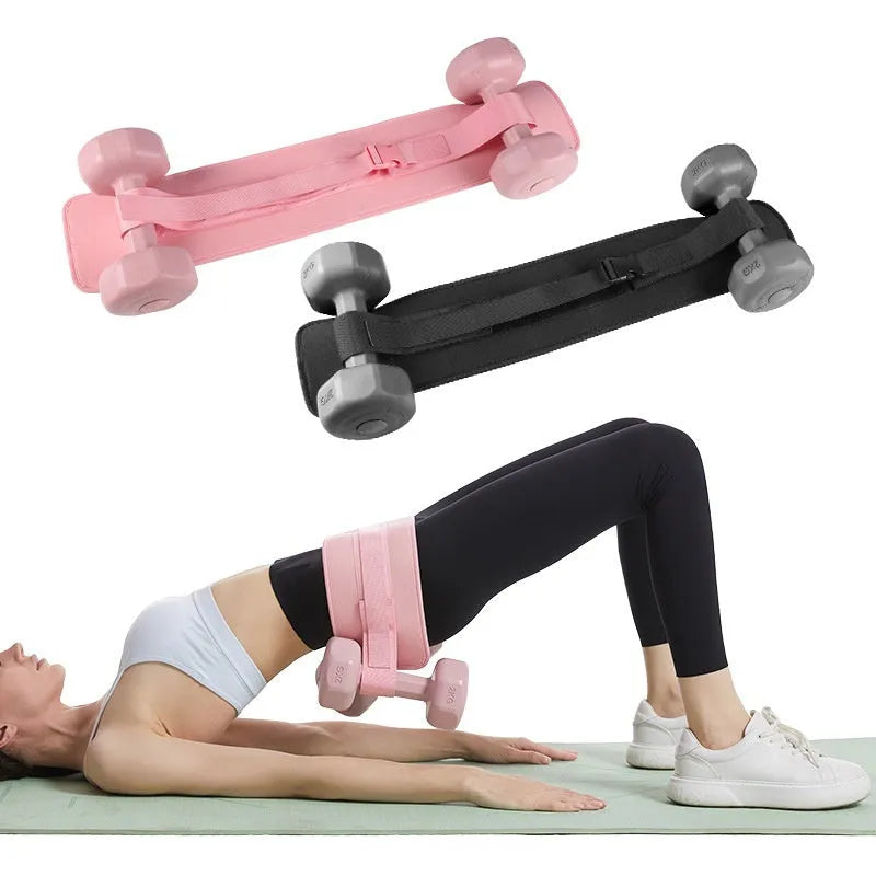 Black hip bridge training belt worn during dumbbell exercise