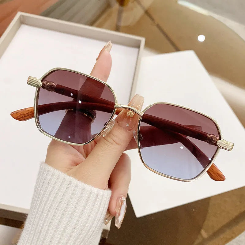 Women's frameless alloy glasses with gold frame and wood grain pattern in various lens colours for fashion and cycling