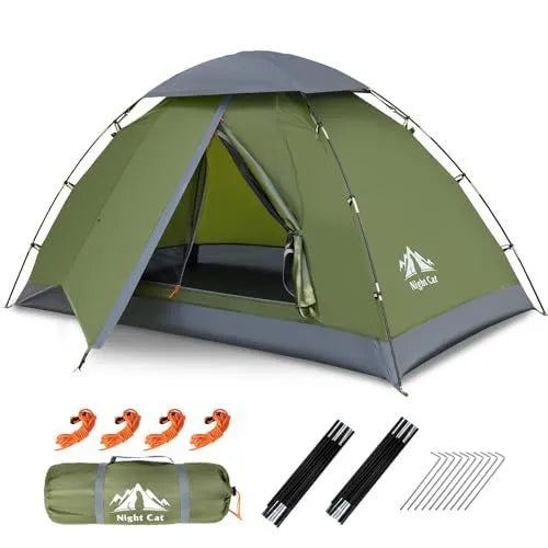 Dark green automatic two-person camping tent with waterproof rainfly set up in outdoor environment