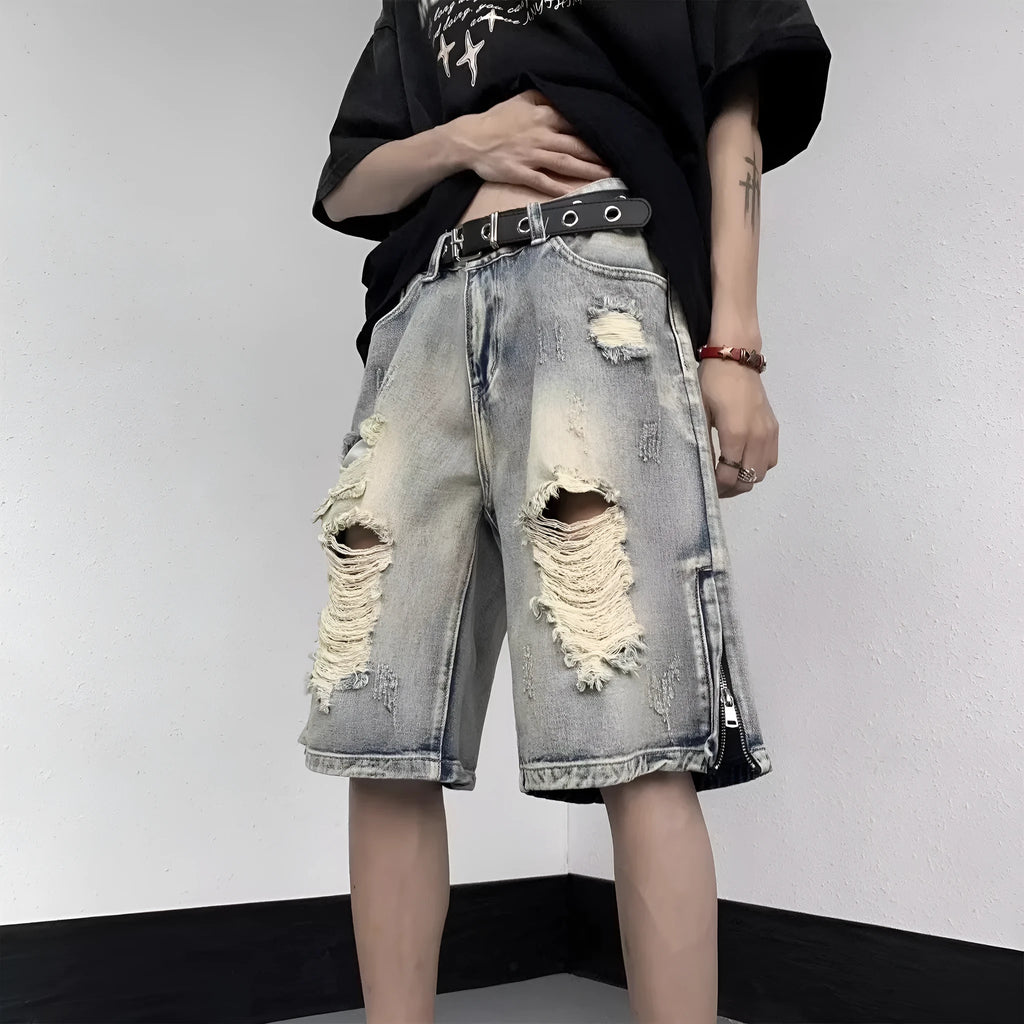Blue retro-style tattered denim shorts with a wide leg loose fit on a hanger.