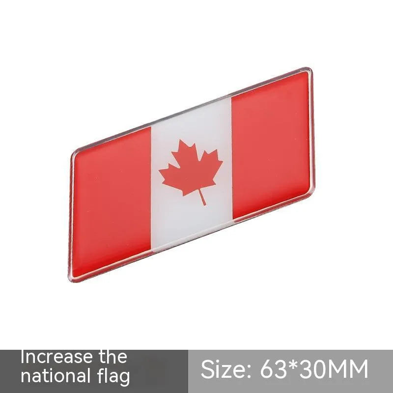 Aluminium national flag car sticker in a parallelogram shape measuring 6.3 by 3 centimetres.