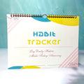 A4 habit tracking journal open showing 12 internal pages for schedule planning