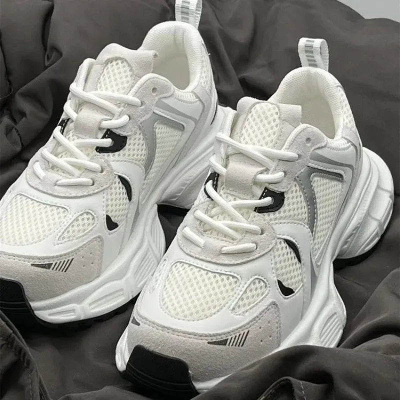 Beige mesh sports shoes with wedge heel and lace-up front on rubber sole