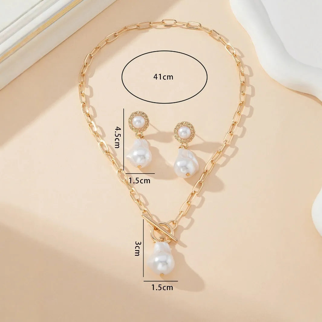 Gold tone retro baroque pearl jewellery set showing necklace and matching earrings