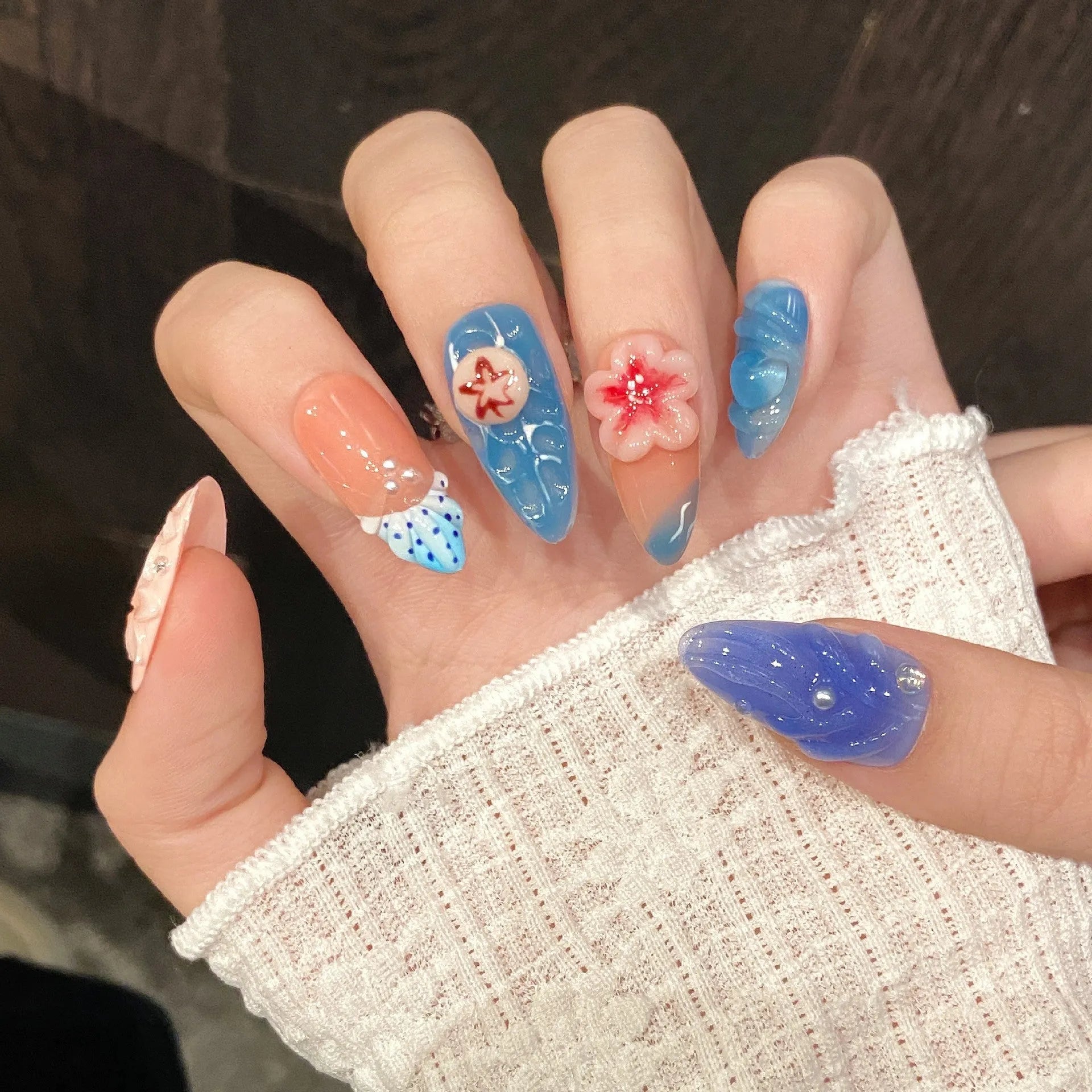 Plastic wearable armour set with three-dimensional carved jellyfish design in almond nail colour