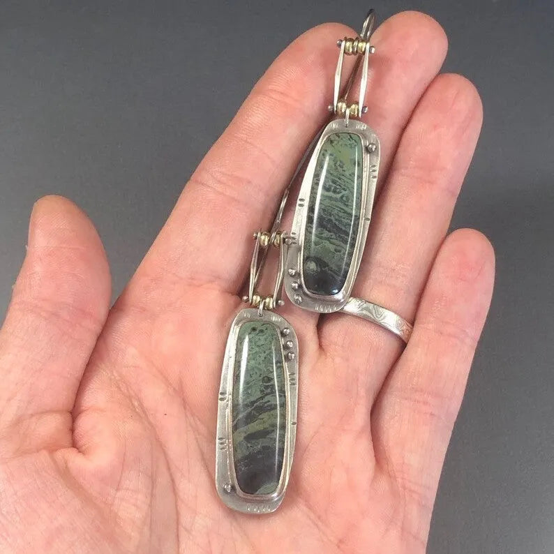 Geometric two-tone marble pattern alloy drop earrings on a white background