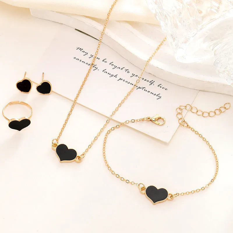 Women's four-piece jewellery set with heart pattern necklace, bracelet, ring and earrings in electroplated alloy