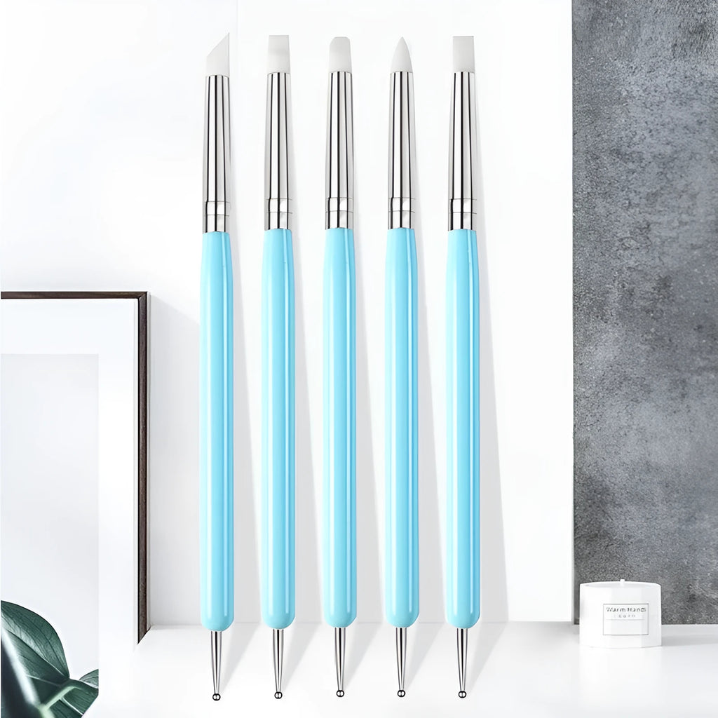 Five blue silicone double point drill pens in a manicure and painting pen set for nail art and craft use