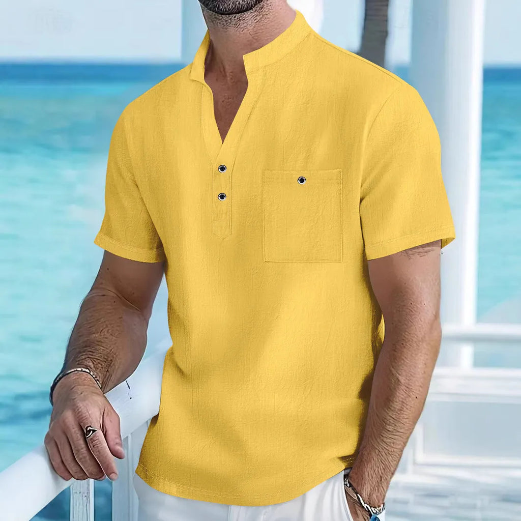Men's light blue linen short sleeve shirt with a stand collar in a loose pullover fit.