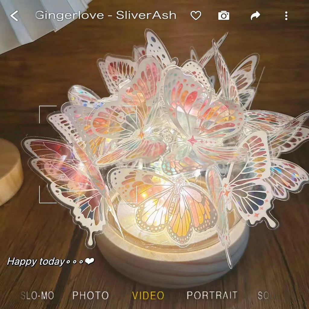 Butterfly-shaped night lamp with glass shade on raw wood base, measuring 12x15cm