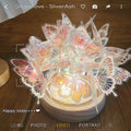 Butterfly-shaped night lamp with glass shade on raw wood base, measuring 12x15cm