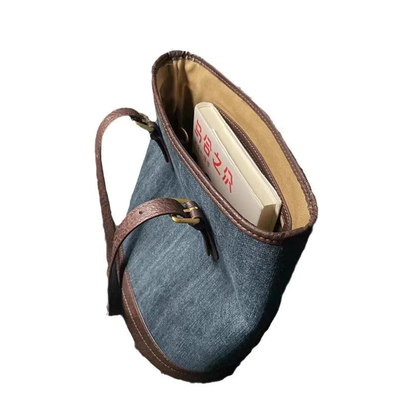 Large denim patchwork retro bucket handbag with a one-shoulder strap.