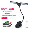 Black music stand light with 28 LED beads clipped to metal music stand