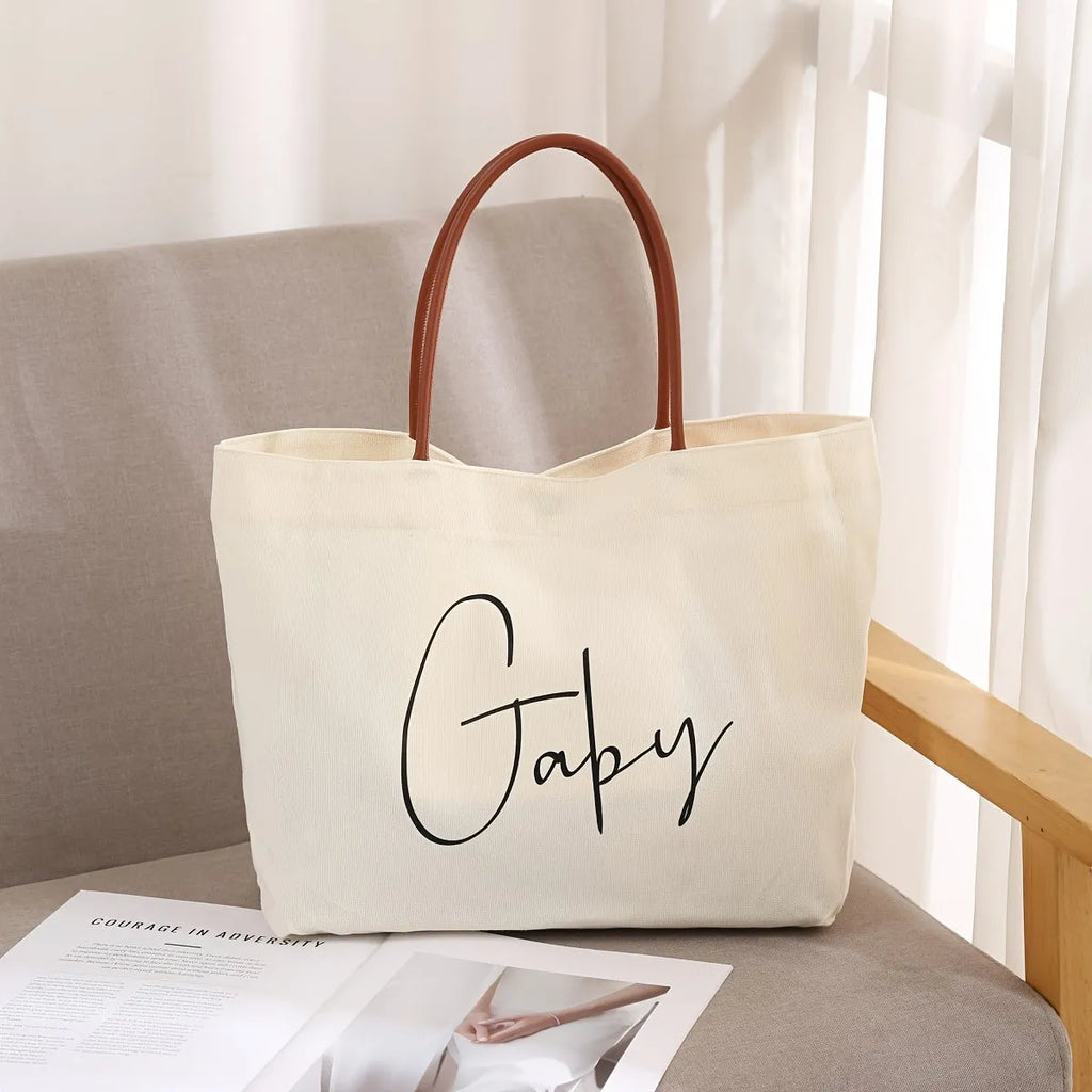 Heavy-duty natural cotton canvas tote bag with flat base and long handles in beige white colour.