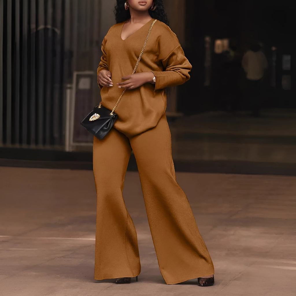 Women's brown suede velvet two-piece casual suit with long sleeves and trousers on a hanger.