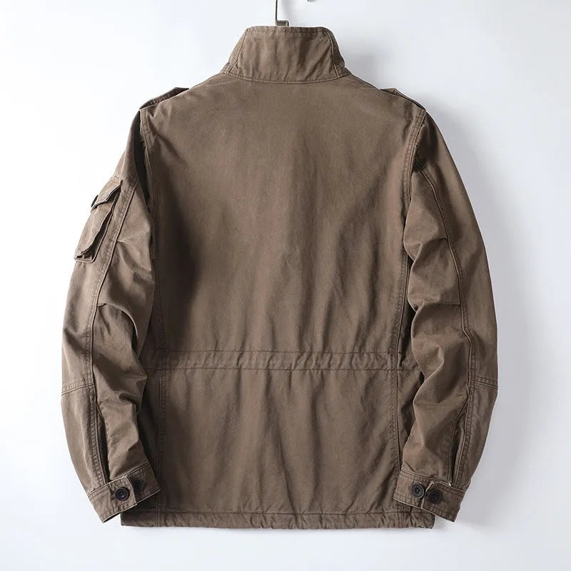 Men's loose fit cotton twill jacket in light coffee colour with zip front, shown on a hanger.