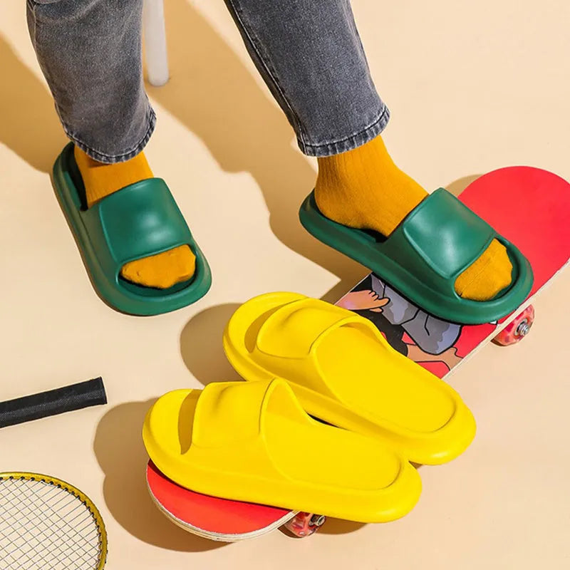 Pair of thick-soled EVA foam slippers in a choice of seven colours, showing non-slip textured sole.