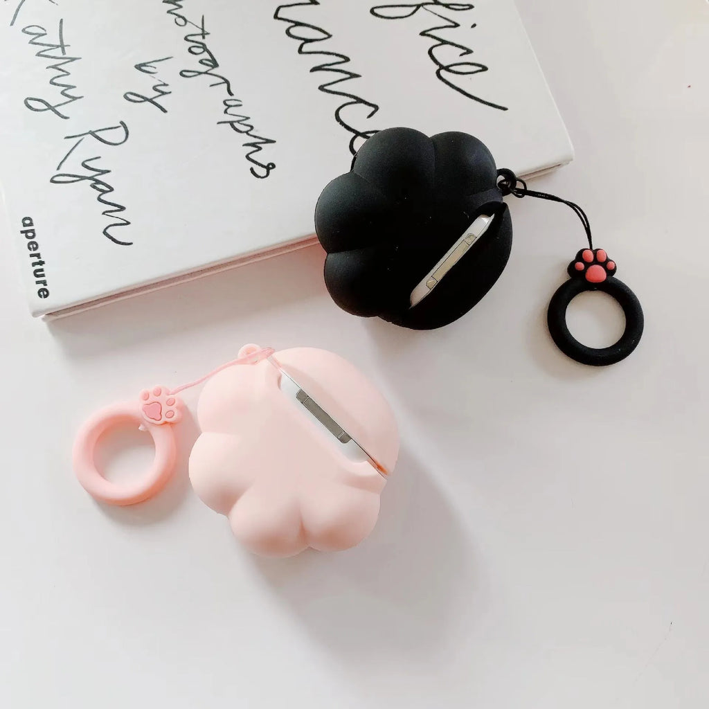 Cat's paw silicone earphone case for Apple AirPods, cute cartoon design, available in black, pink, or white.