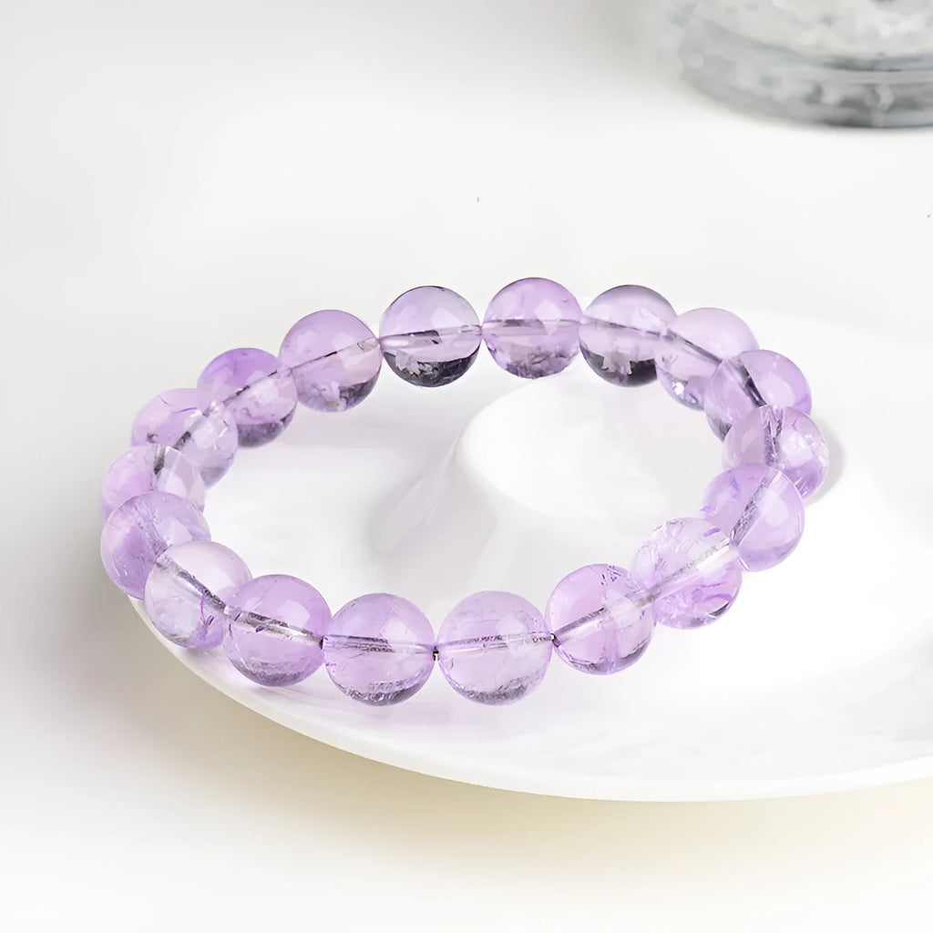 Lavender round bead amethyst bracelet with water ripple design, shown in cream and transparent colour options.