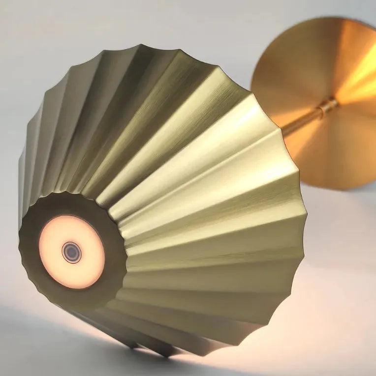 Gold alloy desk lamp with touch switch and interchangeable lampshade on a wooden desk