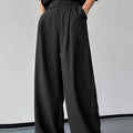 Black men's casual trousers with vertical stripes and front pleats, made from a soft rabbit hair and bamboo fibre blend.