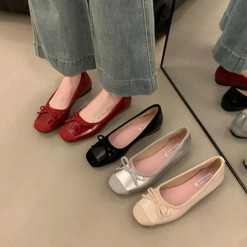 Women's wine red Mary Jane flats with square toe, decorative bow, and a low rubber sole.