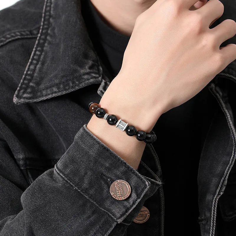 Men's obsidian and silver six-word mantra bracelet with 10mm prayer wheel beads and hand-woven construction