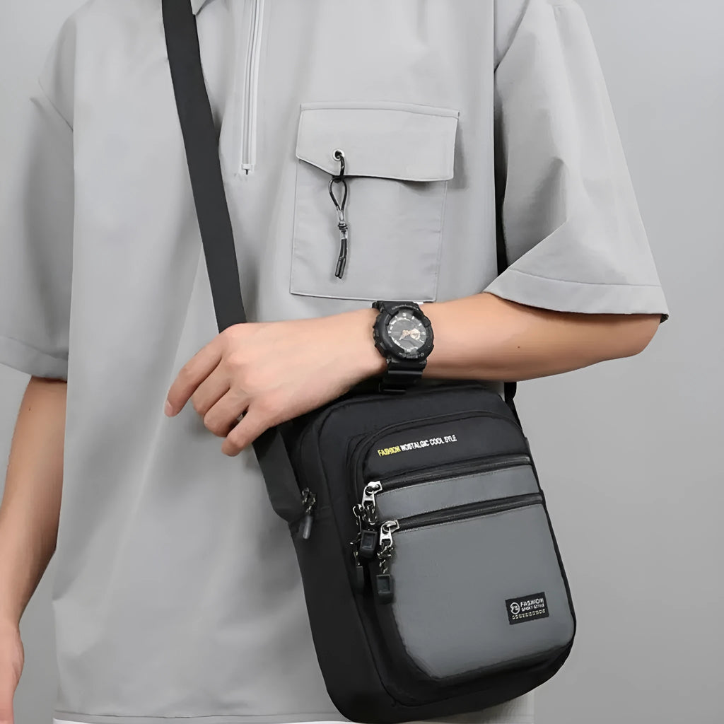 Men's nylon crossbody bag in solid colour with crossbody strap and storage compartments.