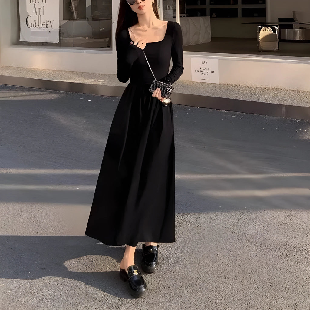Women's black square collar knitted A-line dress with long sleeves and elastic waist.
