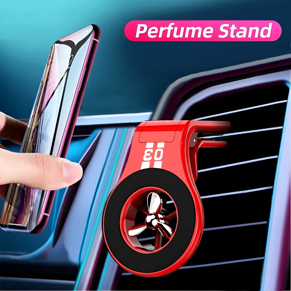 Black magnetic car phone holder clipped to car air vent with smartphone attached and fragrance pads