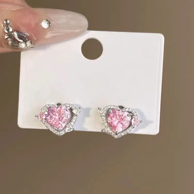 Guardian Heart white K stud earrings with heart shape design and butterfly backs.