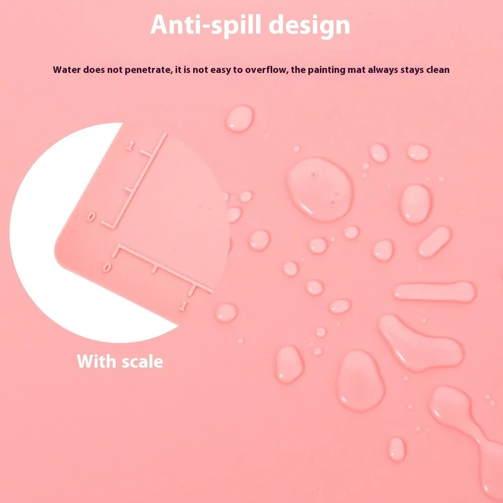 Light blue silicone painting mat with two built-in bowls, sized 50 by 40 centimetres.