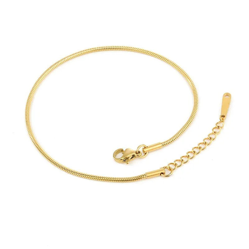 Stainless steel snake chain anklet with adjustable extender in gold colour on a white background