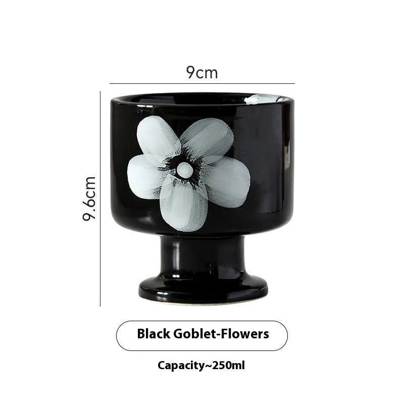 Hand-pinched irregular shaped solid colour ceramic mug on a table, showing its unique form and modern simplicity design.