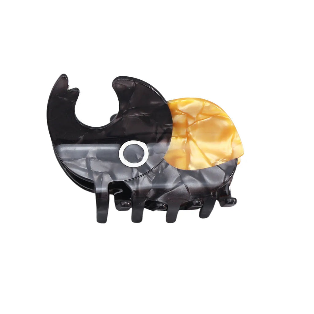 Handmade cartoon beetle grip brooch made from cellulose acetate in green, orange, or white insect designs.